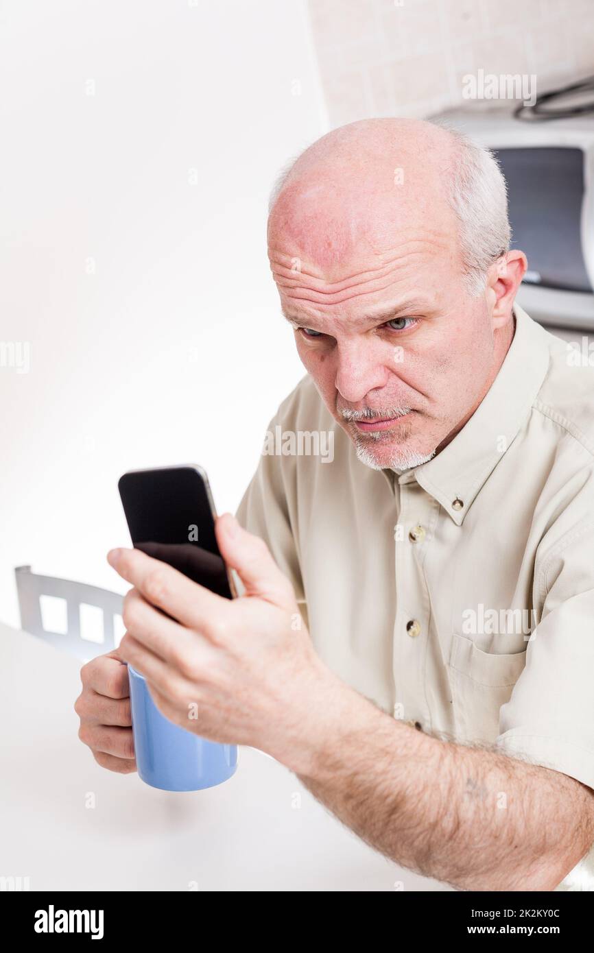 mature man has problems with his eyesight Stock Photo