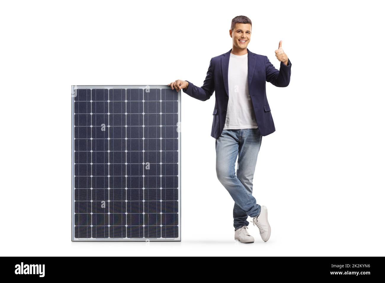 Young man leaning on a solar panel and showing thumbs up isolated on white background Stock Photo
