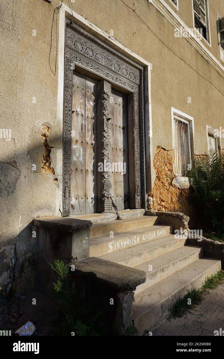 Wooden door with carved ornaments in Stone Town, Zanzibar Stock Photo