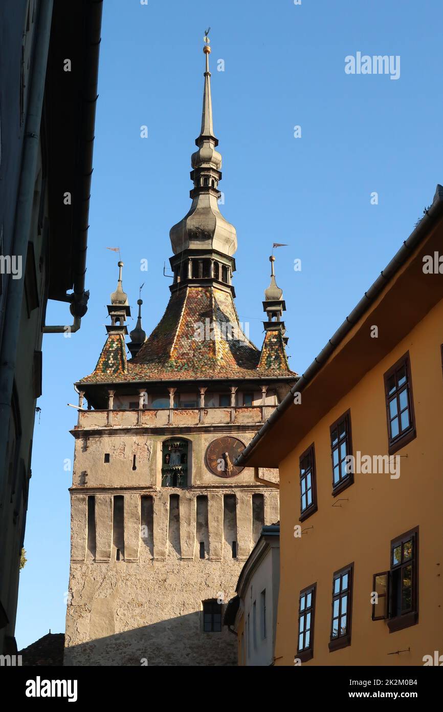 Glimpse on Sighisoaras famous Clock Tower from inside of the Citadel Stock Photo