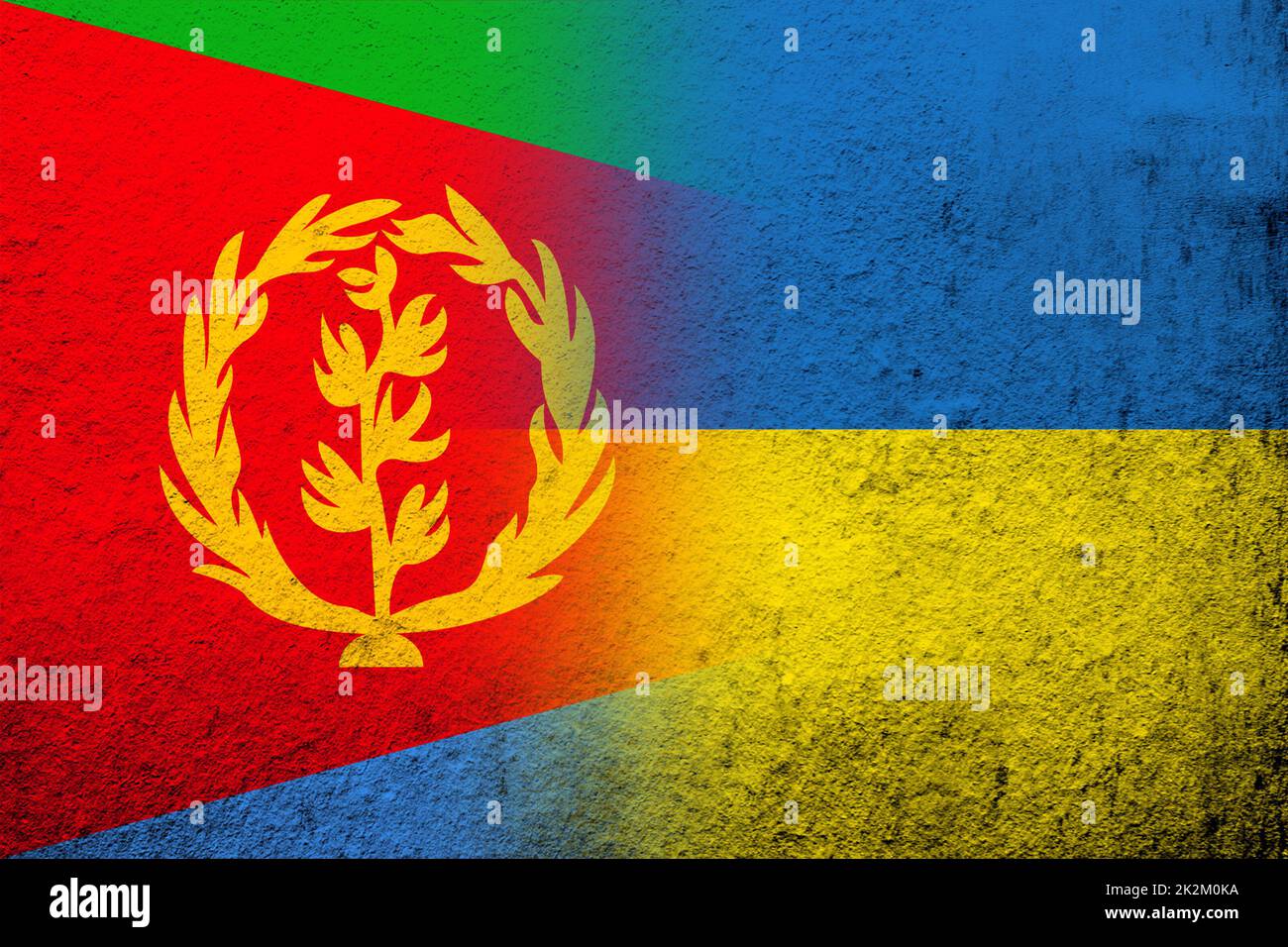 The State of Eritrea national flag with National flag of Ukraine. Grunge background Stock Photo