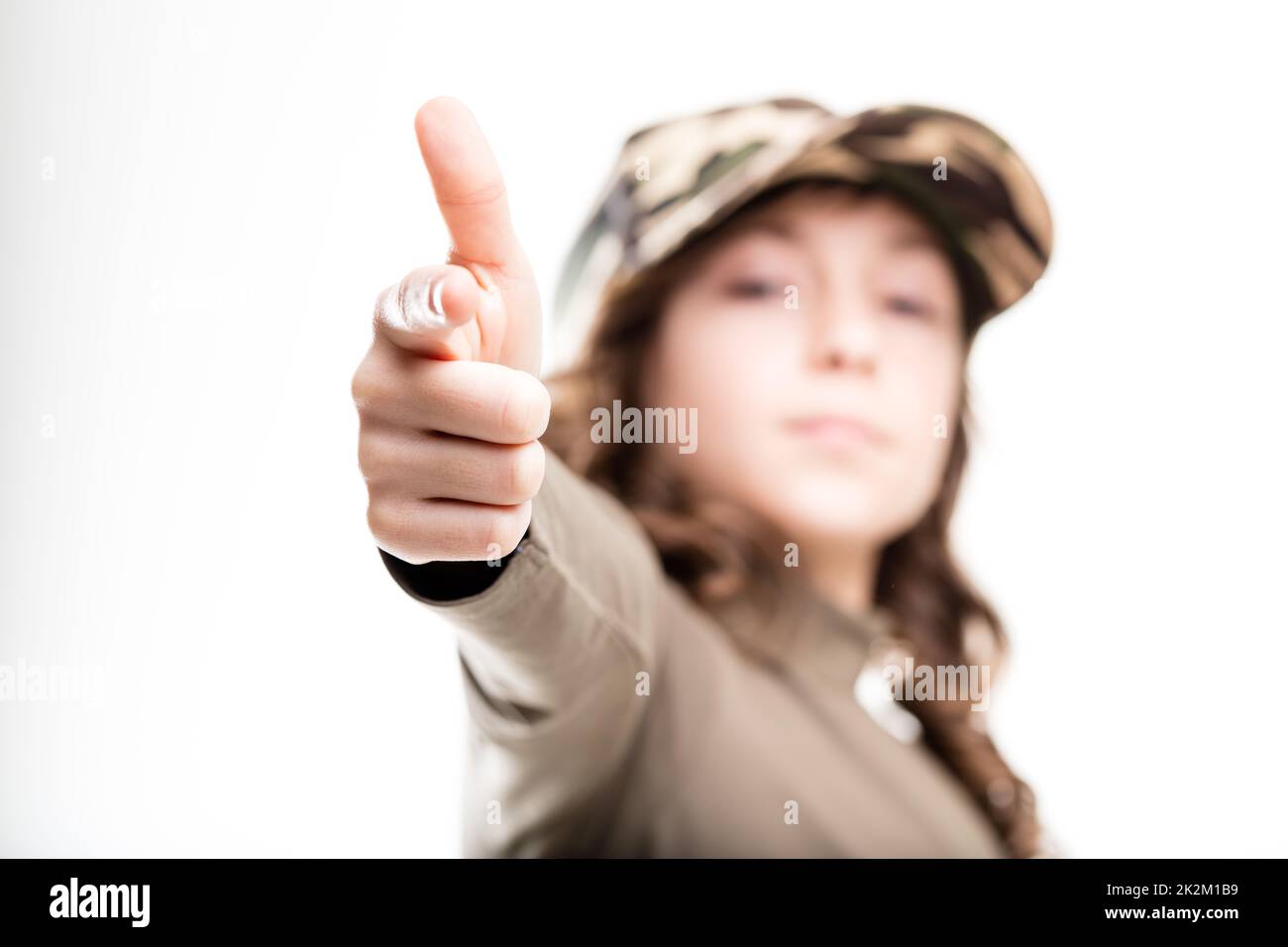 little girl imitating a gun with her hand Stock Photo