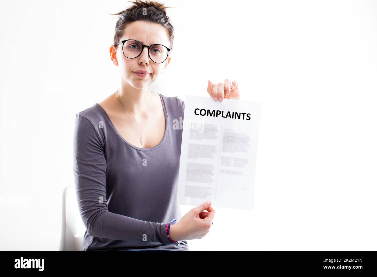 disappointed woman sending complaints to you Stock Photo