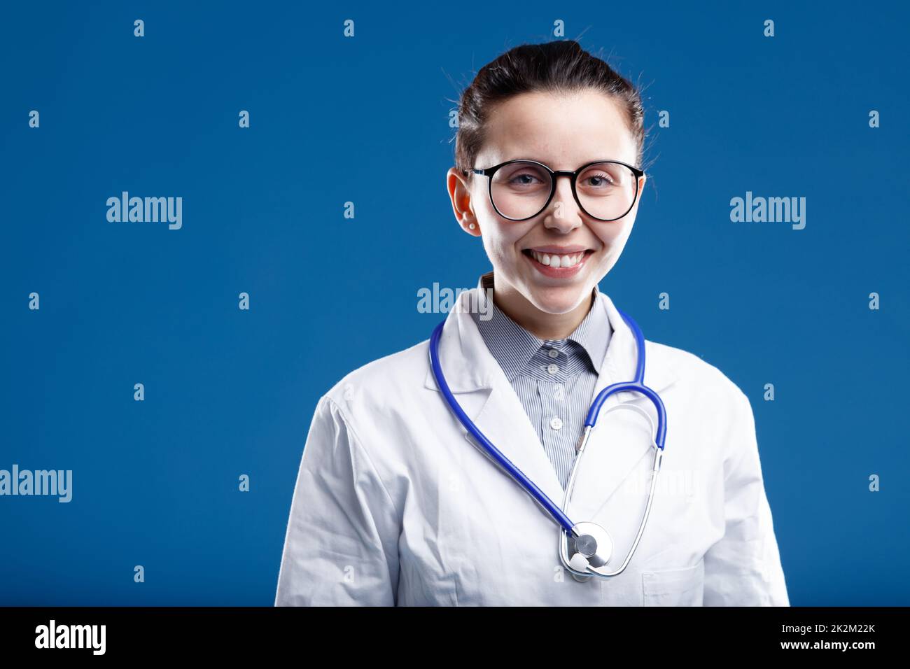 happy medical doctor with large eyeglasses Stock Photo - Alamy