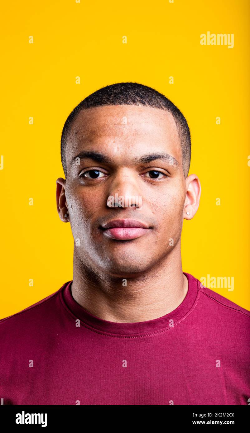 portrait of a black man on yellow background Stock Photo