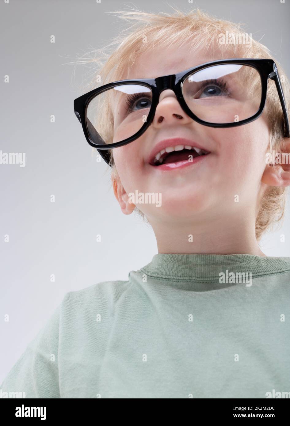 portrait of a little child with BIG eyeglasses Stock Photo