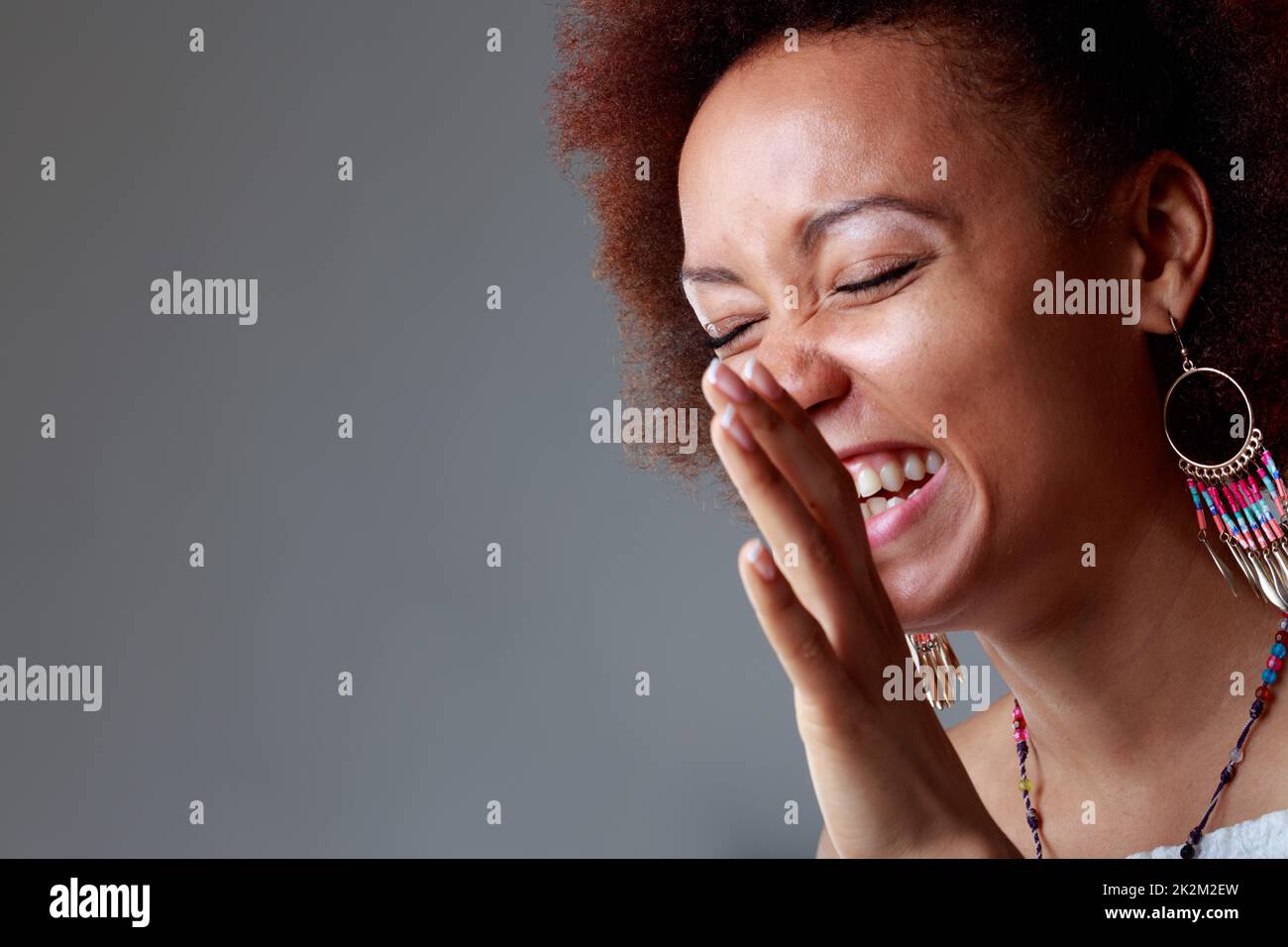 Candid portrait of a laughing young Black woman Stock Photo