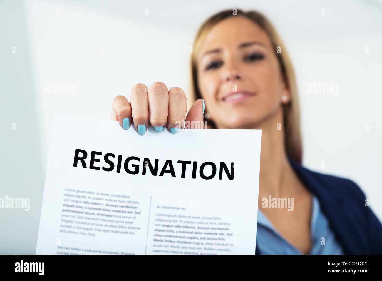 woman resigning with a smile on her face Stock Photo