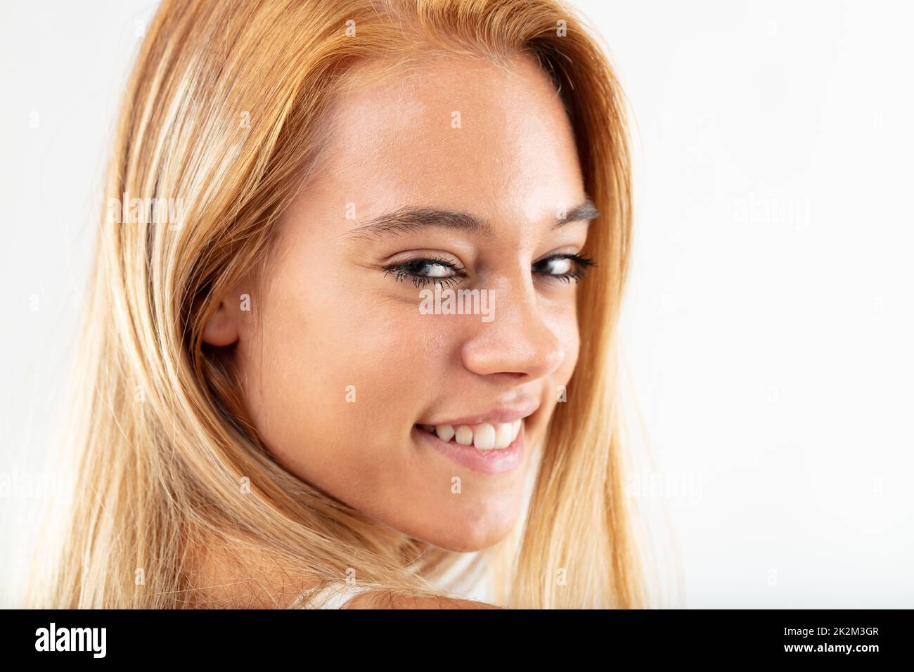 Happy friendly young woman with a lovely smile Stock Photo