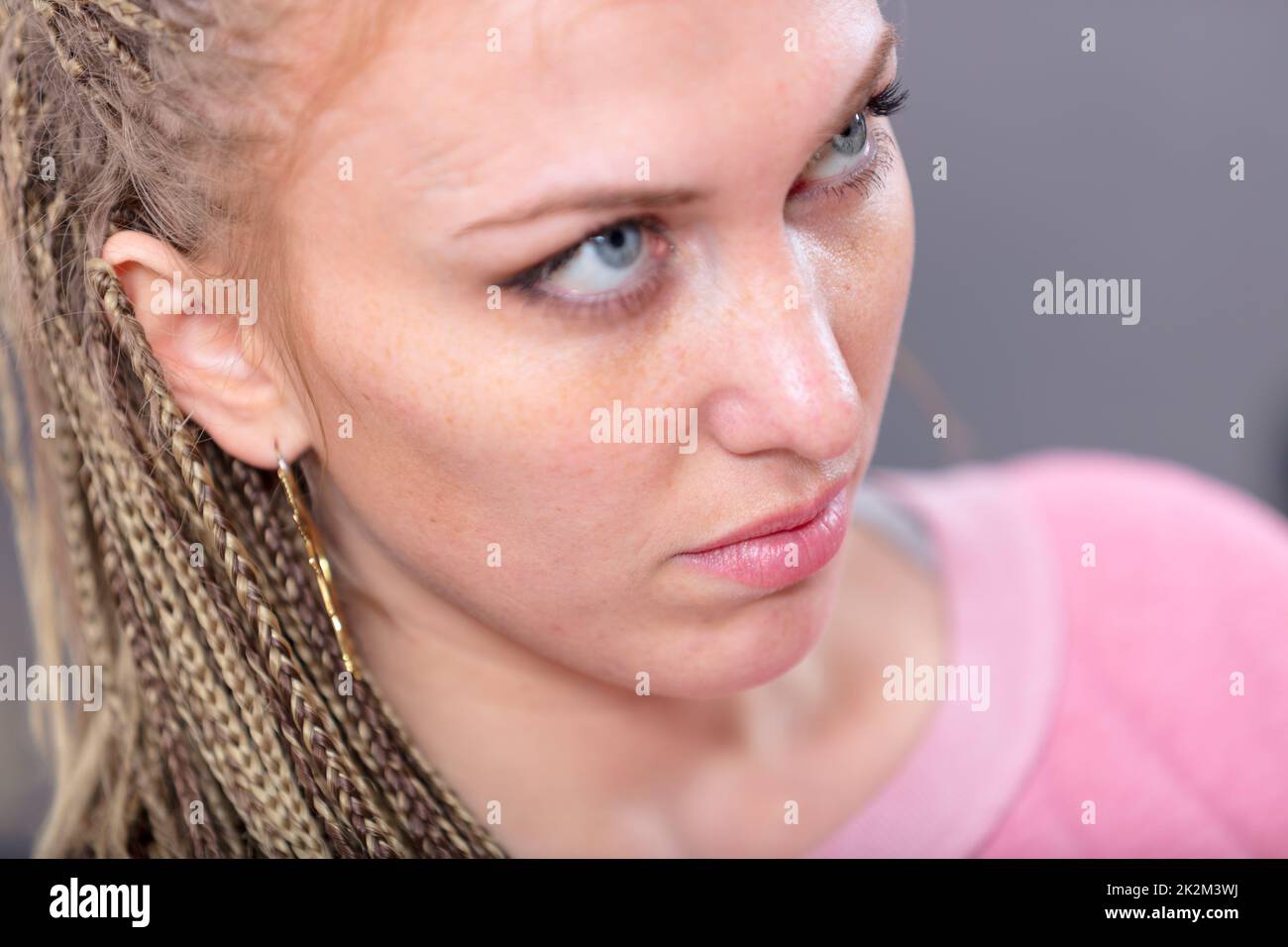 Attractive blond woman with soulful blue eyes Stock Photo