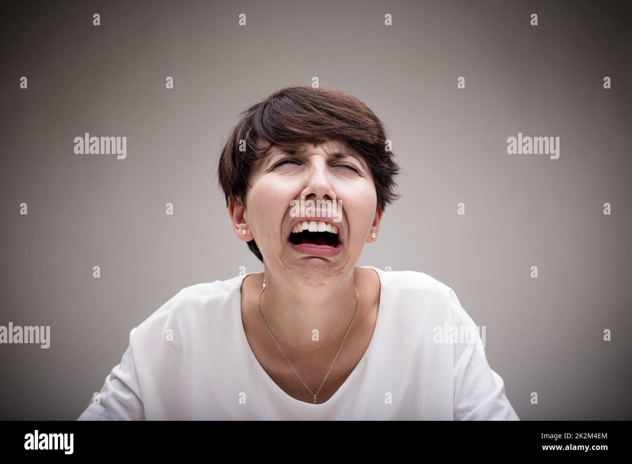 woman just wanting to cry because of her anguish Stock Photo