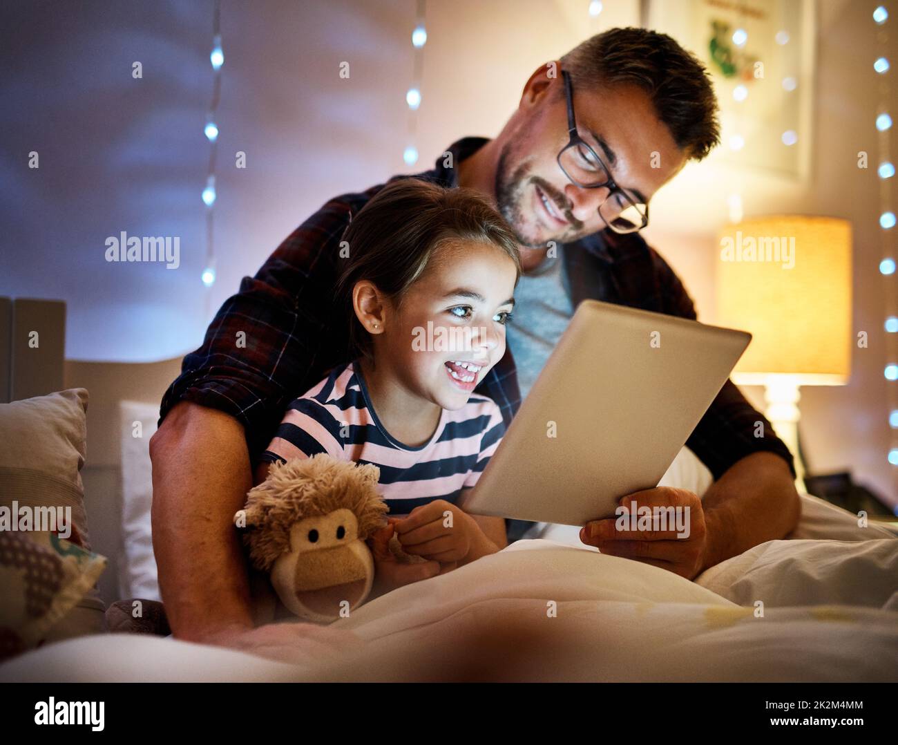She loves story time with daddy. Cropped shot of a father reading his