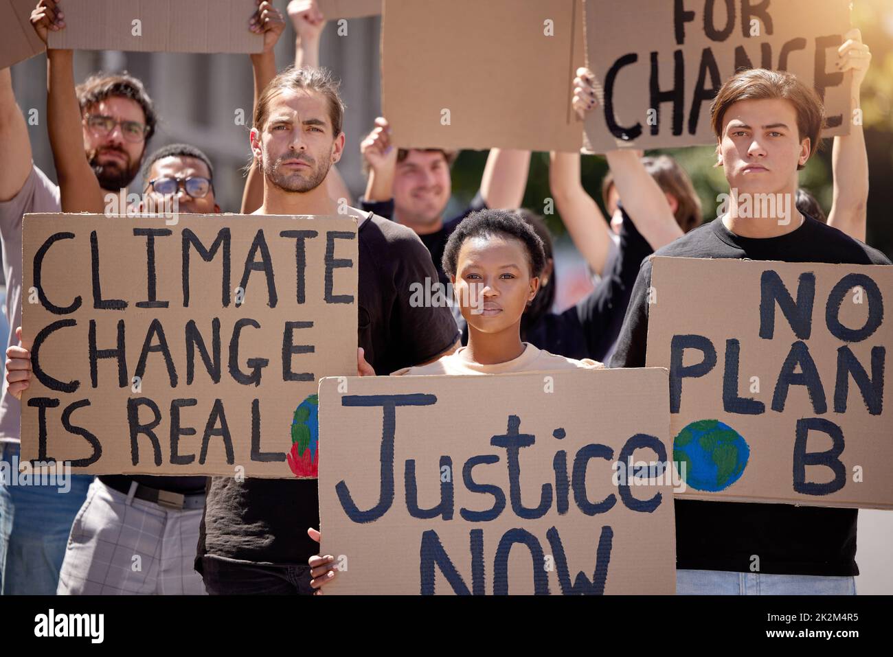 We only have one planet. Shot of a group of people protesting climate change. Stock Photo