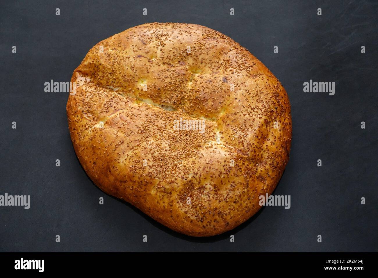 Pita with sesame seeds in Ramadan, pita bread in Turkish culture, Ramadan and pide Stock Photo