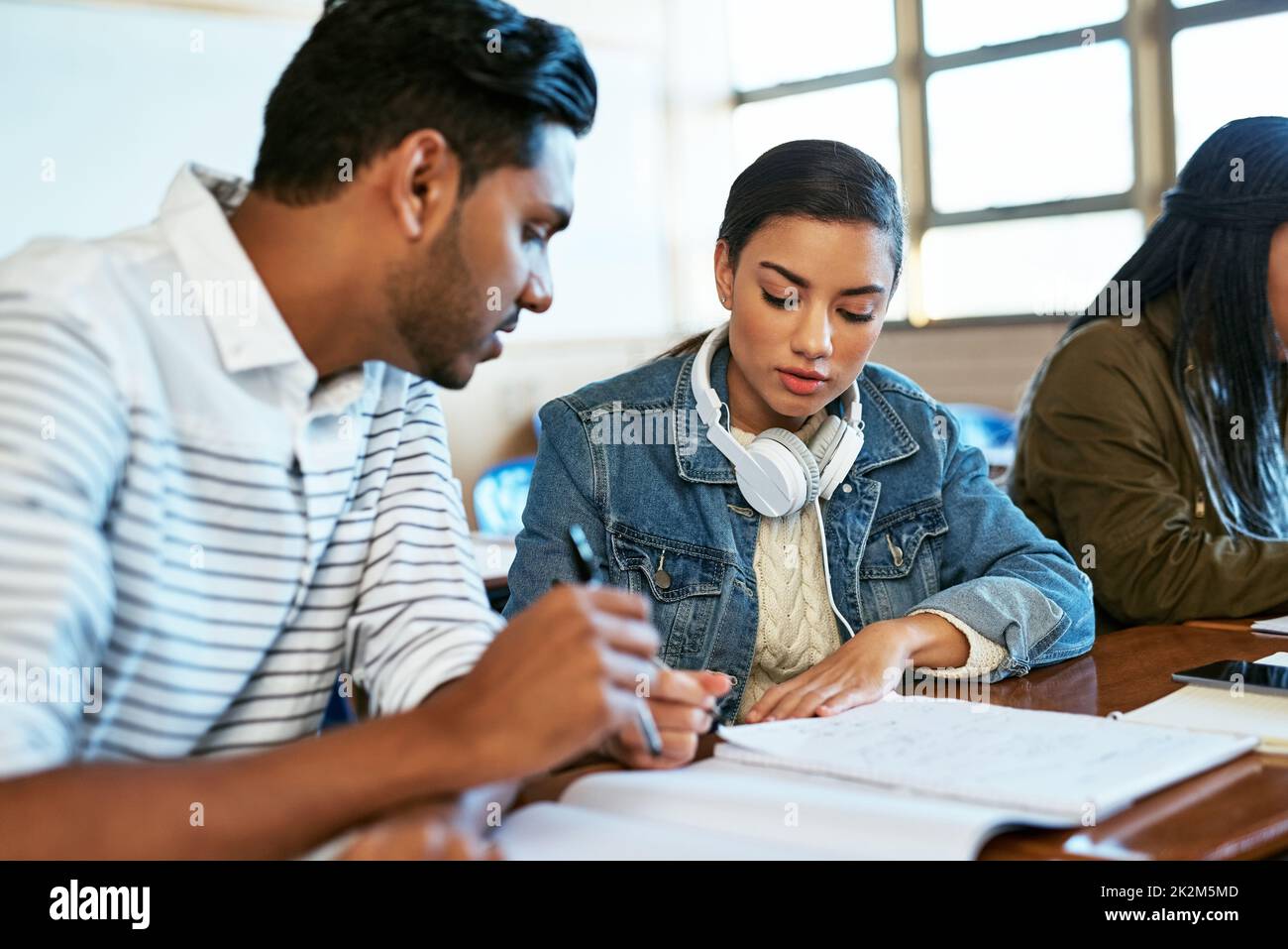 Doing it for our future. Cropped shot of two young university students