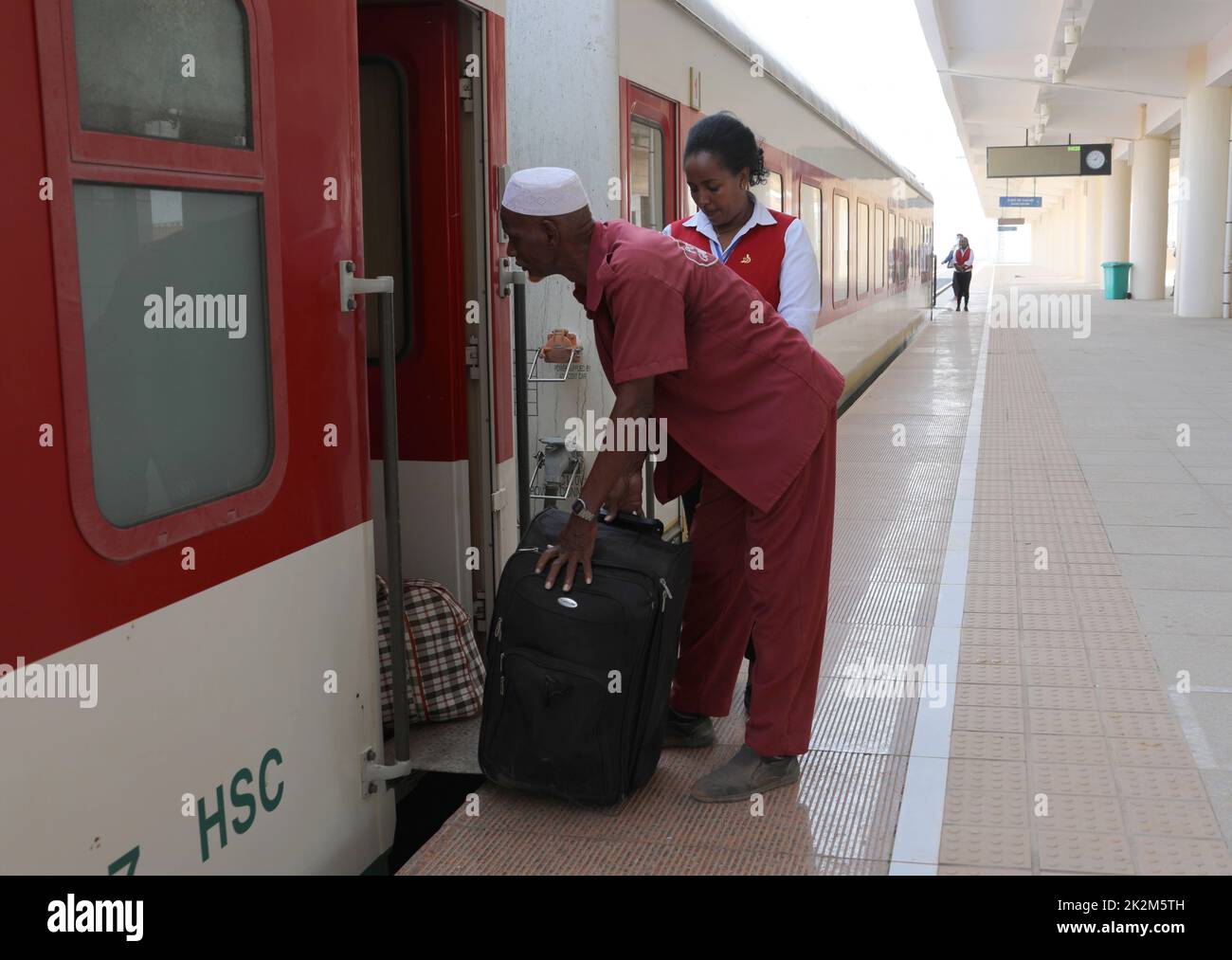 Djibouti City. 19th Sep, 2022. A worker carries luggage for passengers at the Nagad railway station along the Ethiopia-Djibouti railway in Djibouti, Sept. 19, 2022. The Chinese-built 752.7-km-long Ethiopia-Djibouti standard gauge railway, also known as the Addis Ababa-Djibouti railway, is the first fully electrified trans-boundary railway on the African continent. The Ethiopia-Djibouti railway company has reported increasing revenue during its four years of operation while driving economic growth and industrialization along the route. Credit: Dong Jianghui/Xinhua/Alamy Live News Stock Photo