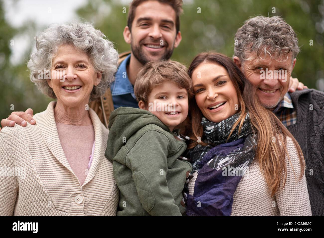 Nothing comes close to the bond of family. Three generations of family enjoying a day out in the park together. Stock Photo