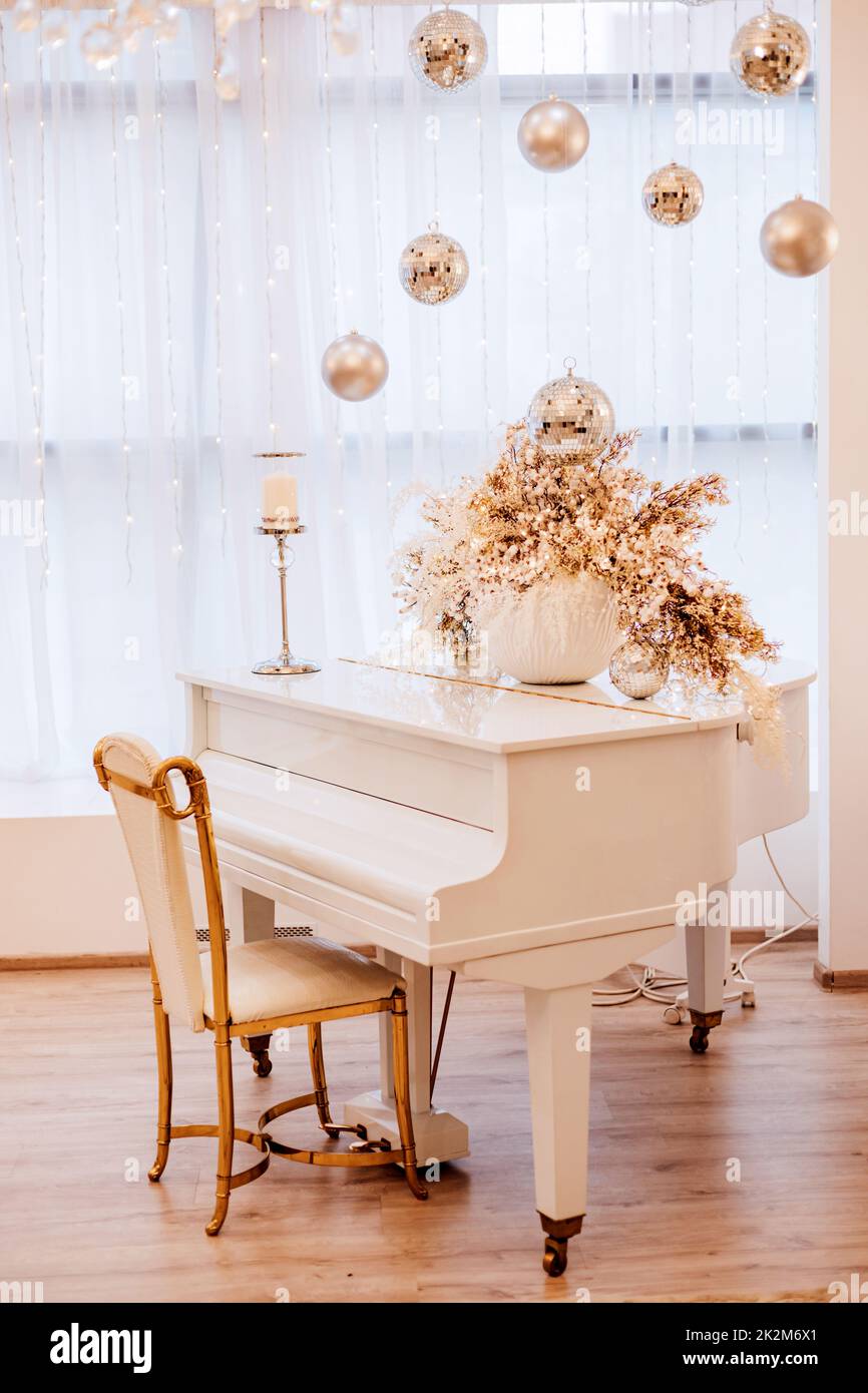 White luxury grand piano in a bright New Year's interior Stock Photo ...