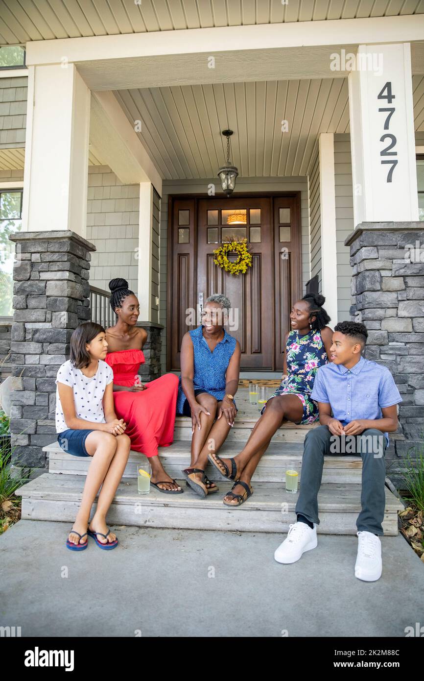 Family on front porch candid hires stock photography and images Alamy