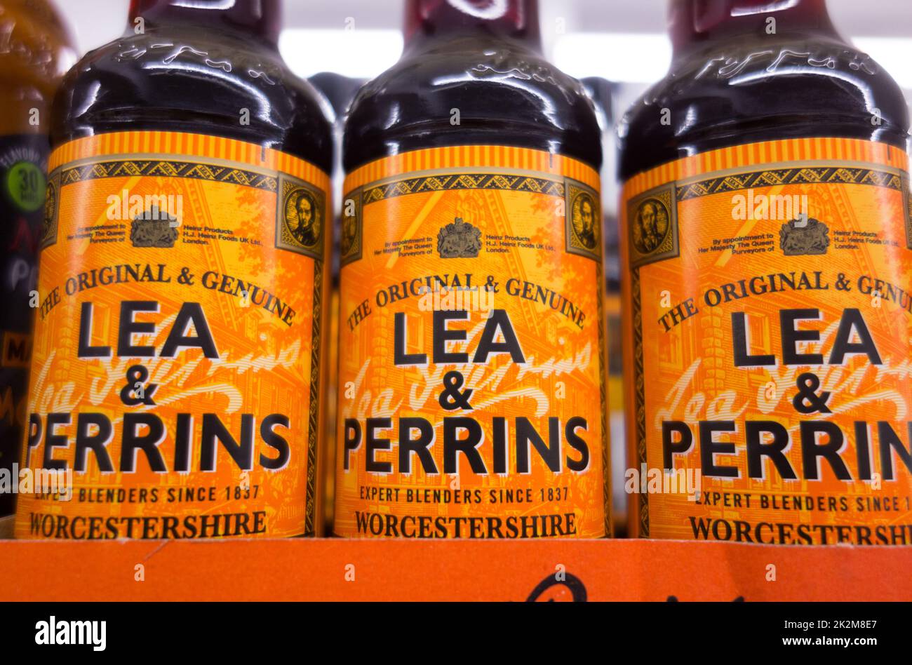 Closeup of Lea and Perrins glass bottles on a shelf in a supermarket, England, UK Stock Photo