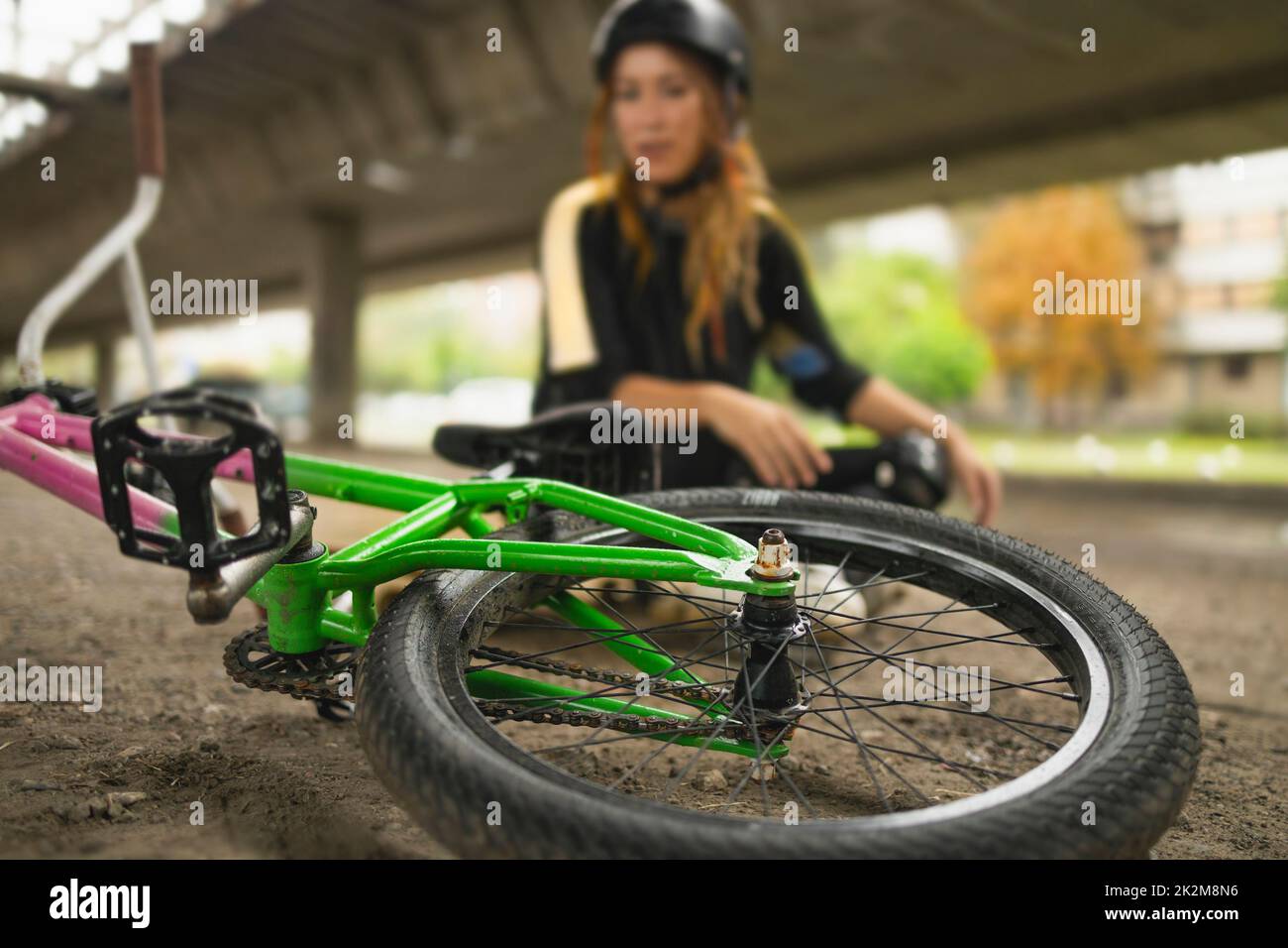 Bicycle in front of young active woman Stock Photo