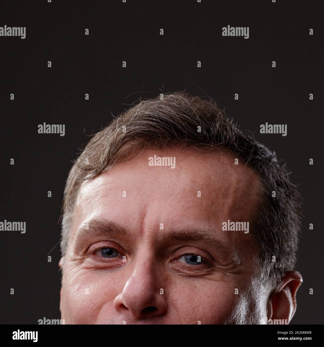 Cropped upper face portrait of a middle-aged man Stock Photo