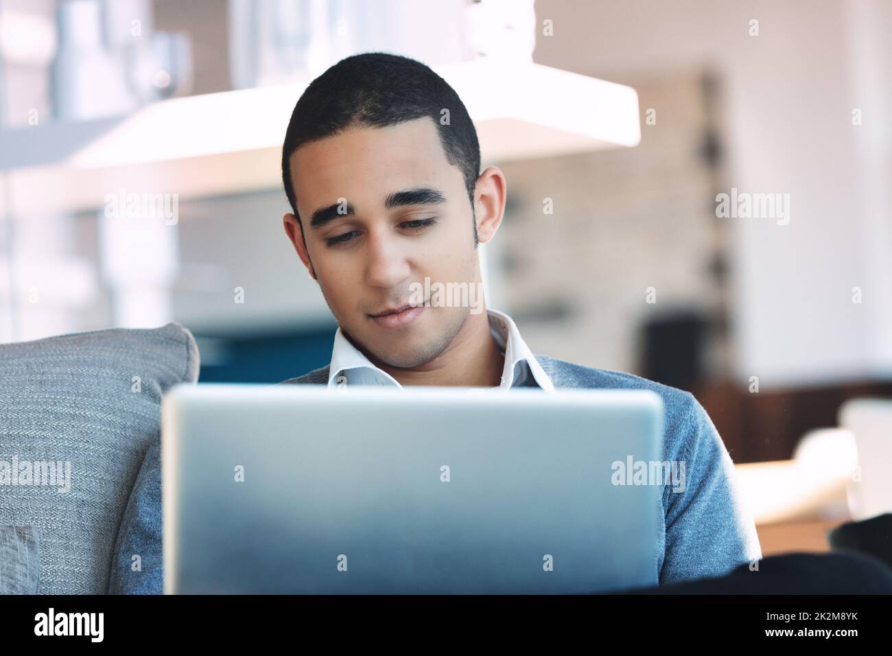 Young Black businessman browsing on his computer Stock Photo