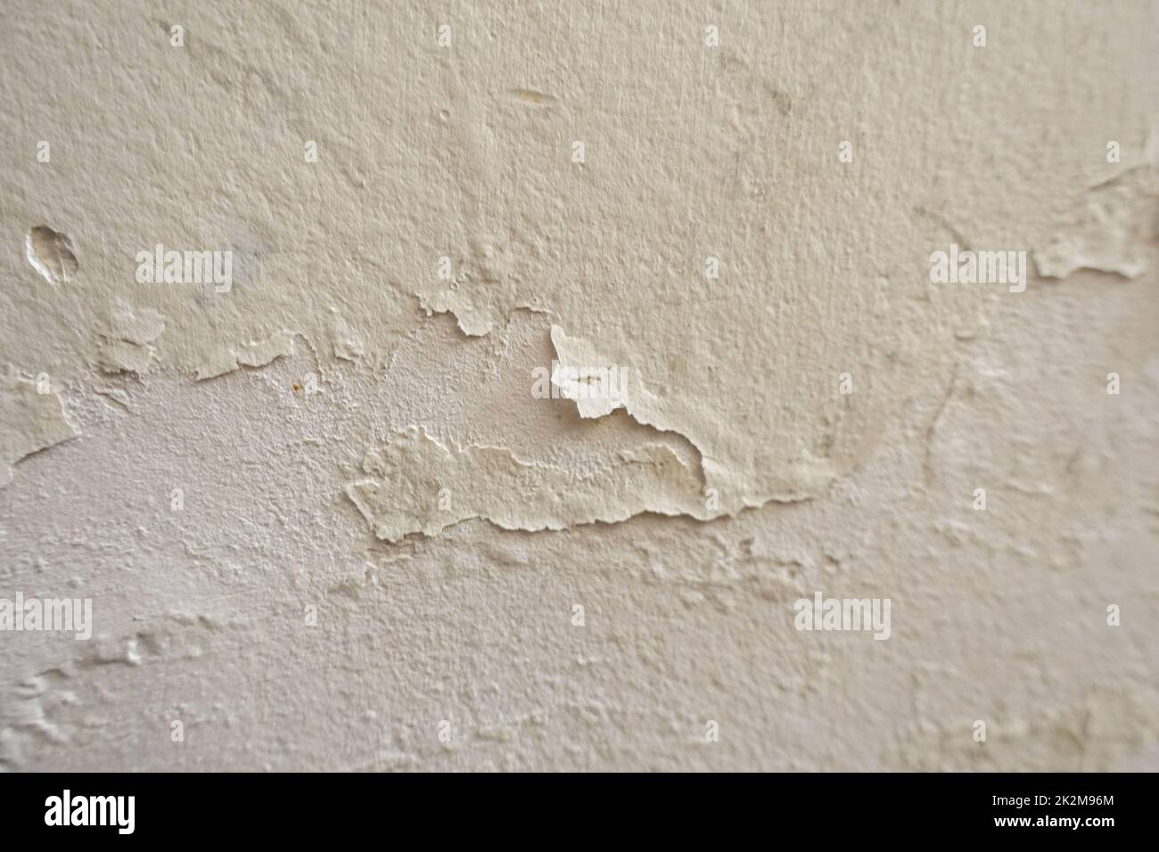 wall whose paint has peeled off due to water and humidity Stock Photo