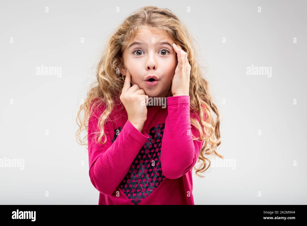 Cute little girl with a look of astonishment Stock Photo