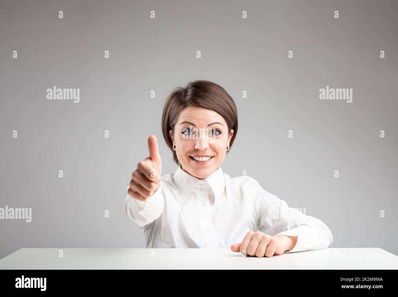 Thumbs up excited young woman hi-res stock photography and images - Alamy