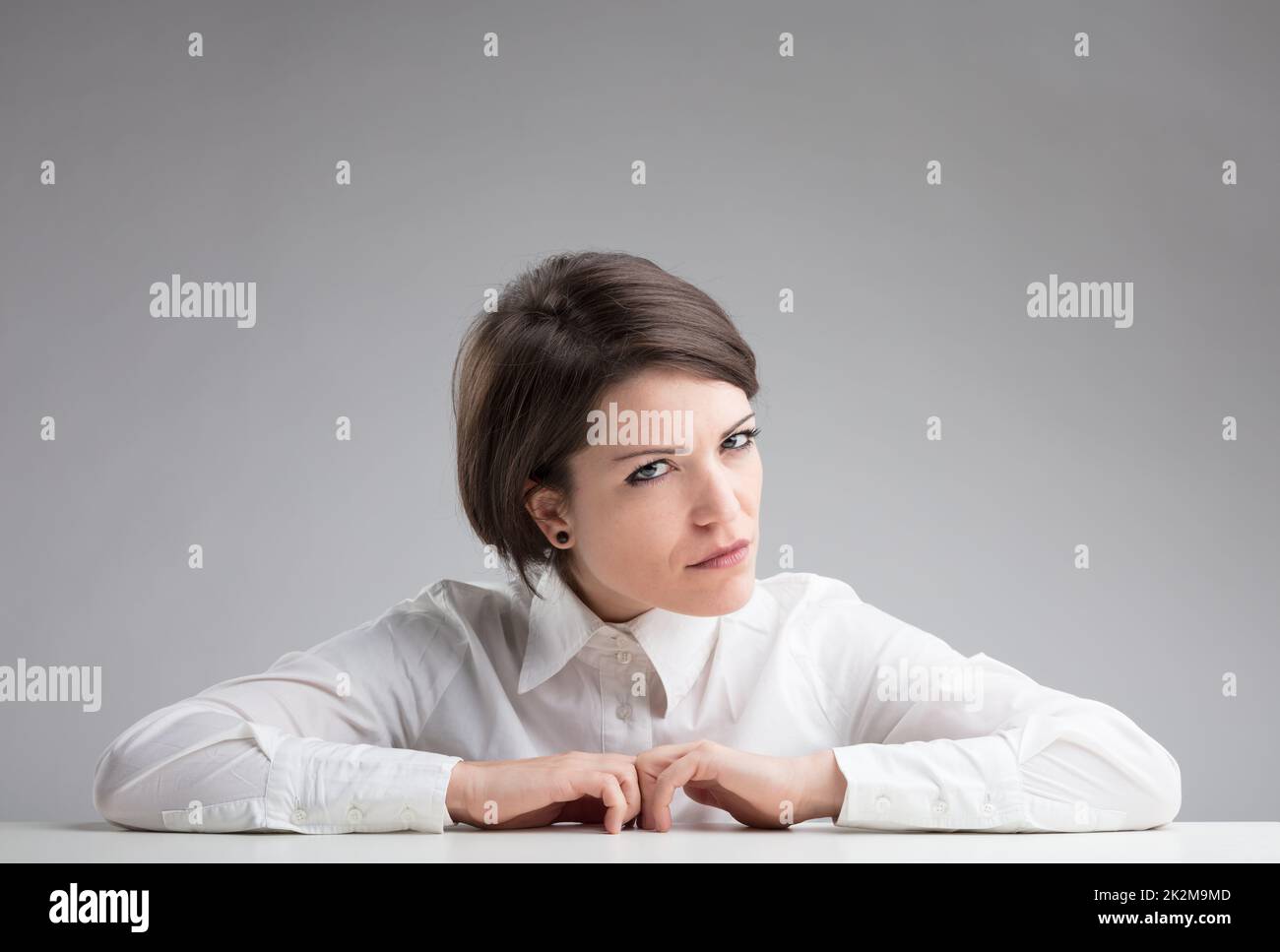 very suspicious woman spotting to find out Stock Photo