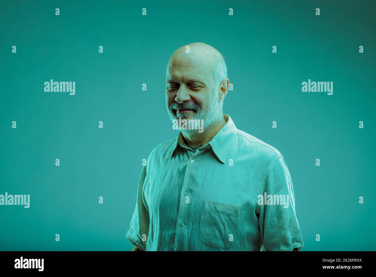Smiling friendly senior man with grey beard Stock Photo Alamy
