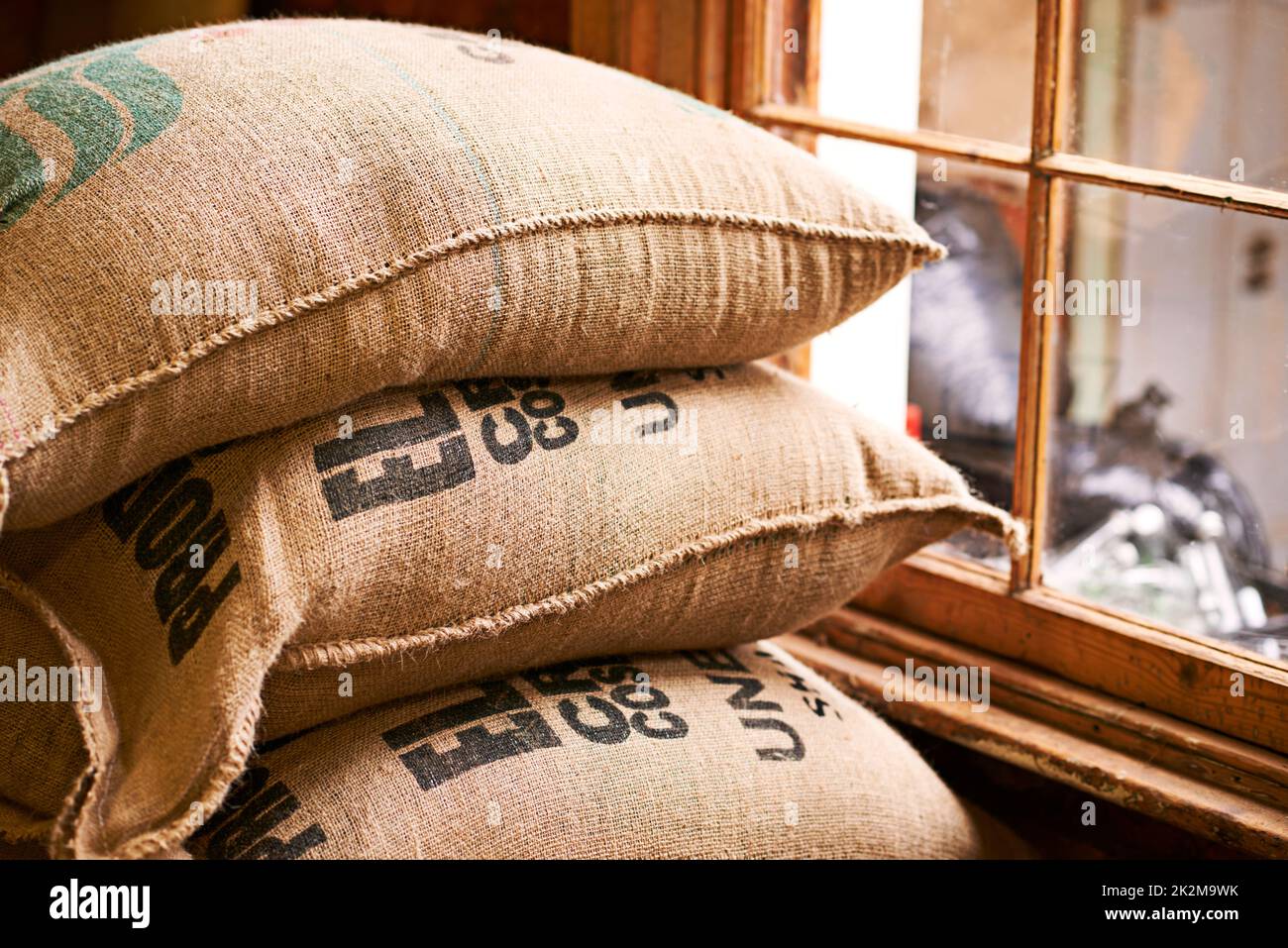 The essence of the coffee industry. Shot of a burlap sack full of unprocessed coffee beans. Stock Photo