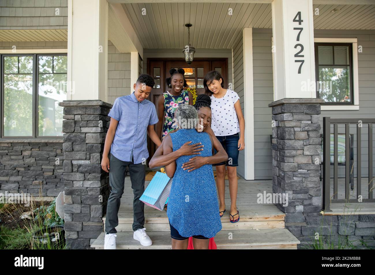 Mature woman welcoming daughter hi-res stock photography and images - Alamy