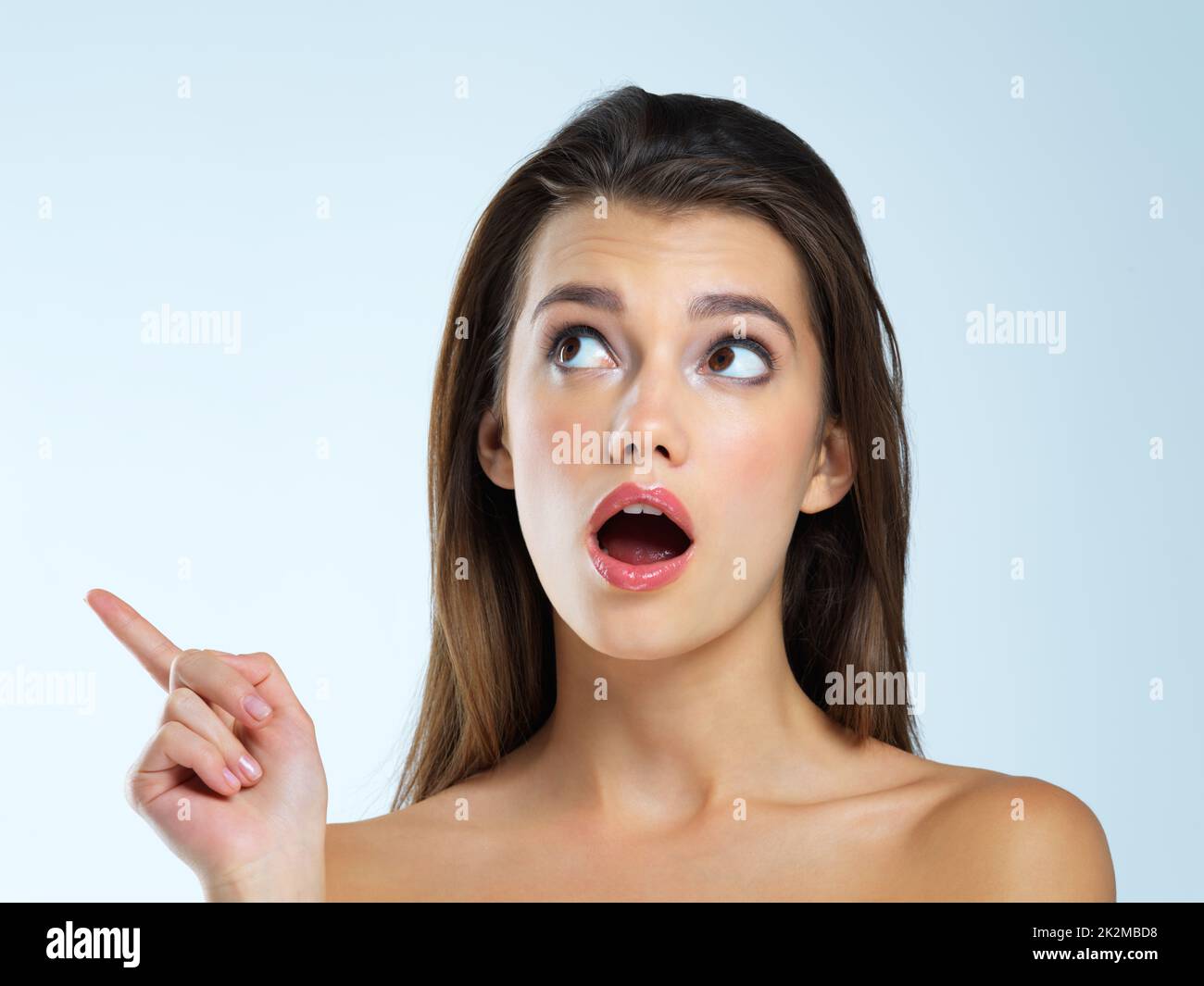 That caught her by surprise. Studio shot of a beautiful young woman