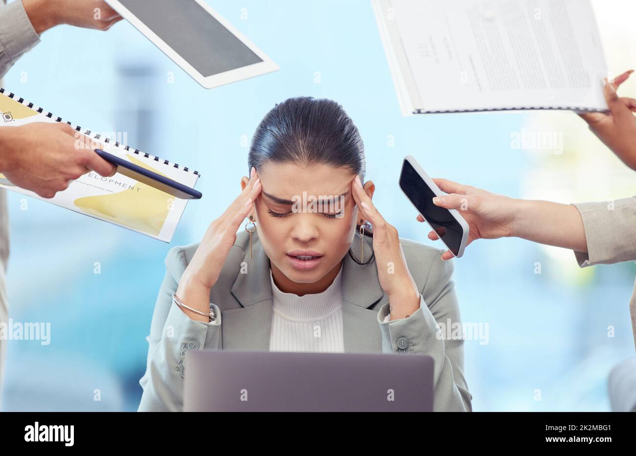 Always set healthy boundaries. Shot of a young woman having a stressful day at work. Stock Photo