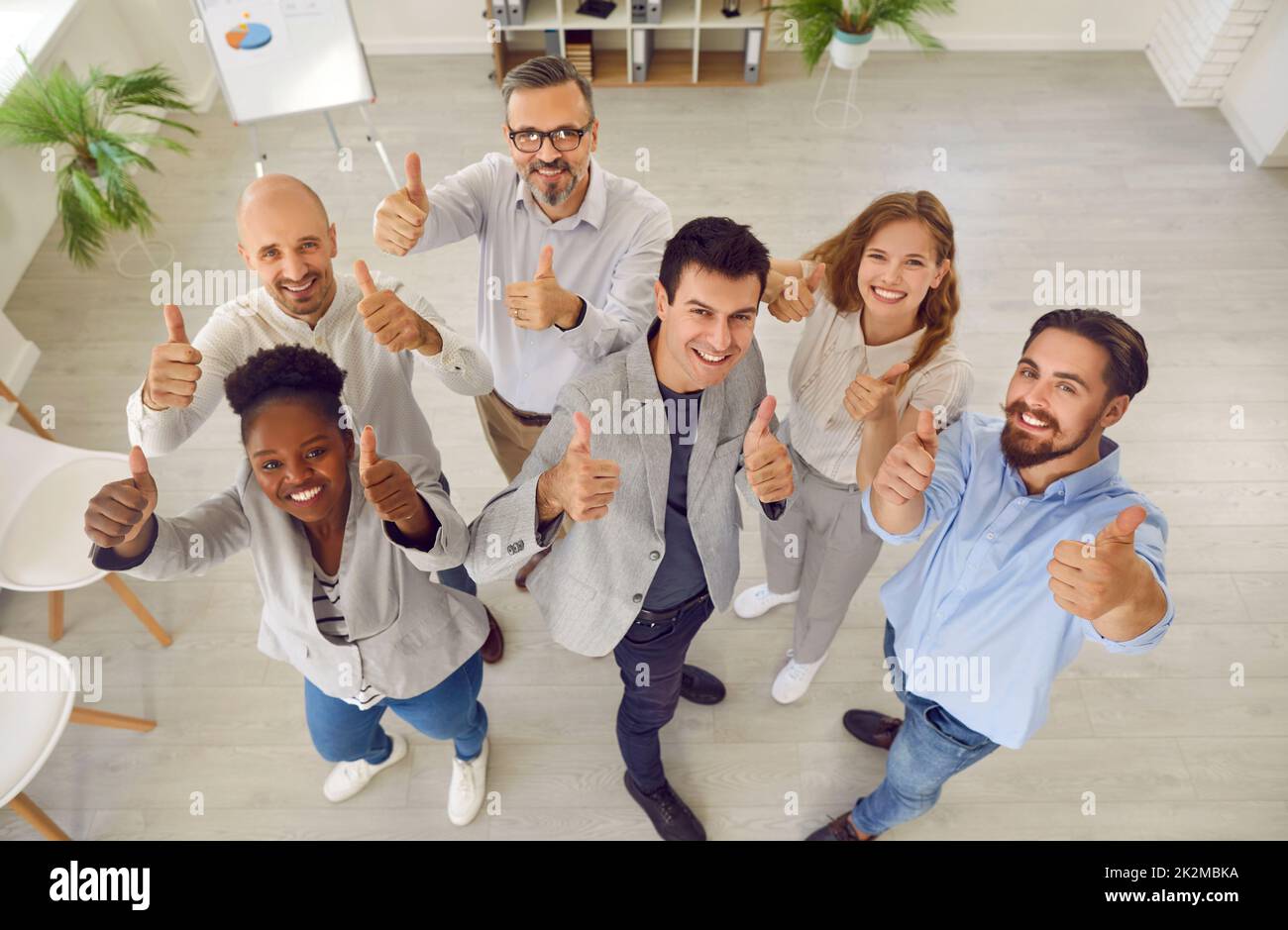 Group of happy colleagues or satisfied customers give recommendation for good service. Stock Photo