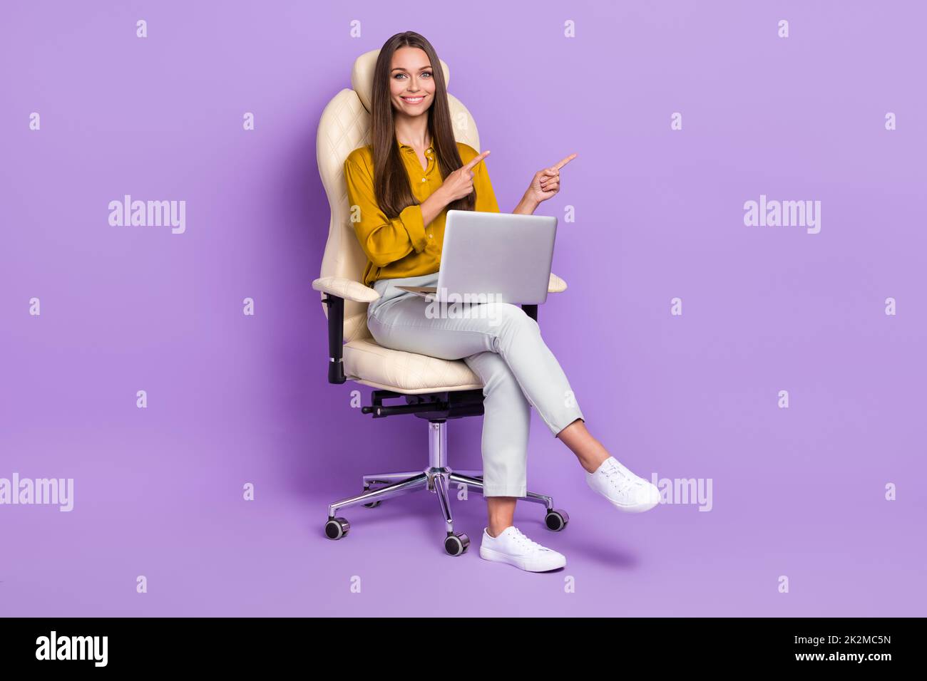 Full length photo of lady sit index promo wear blouse trousers shoes isolated on purple color background Stock Photo