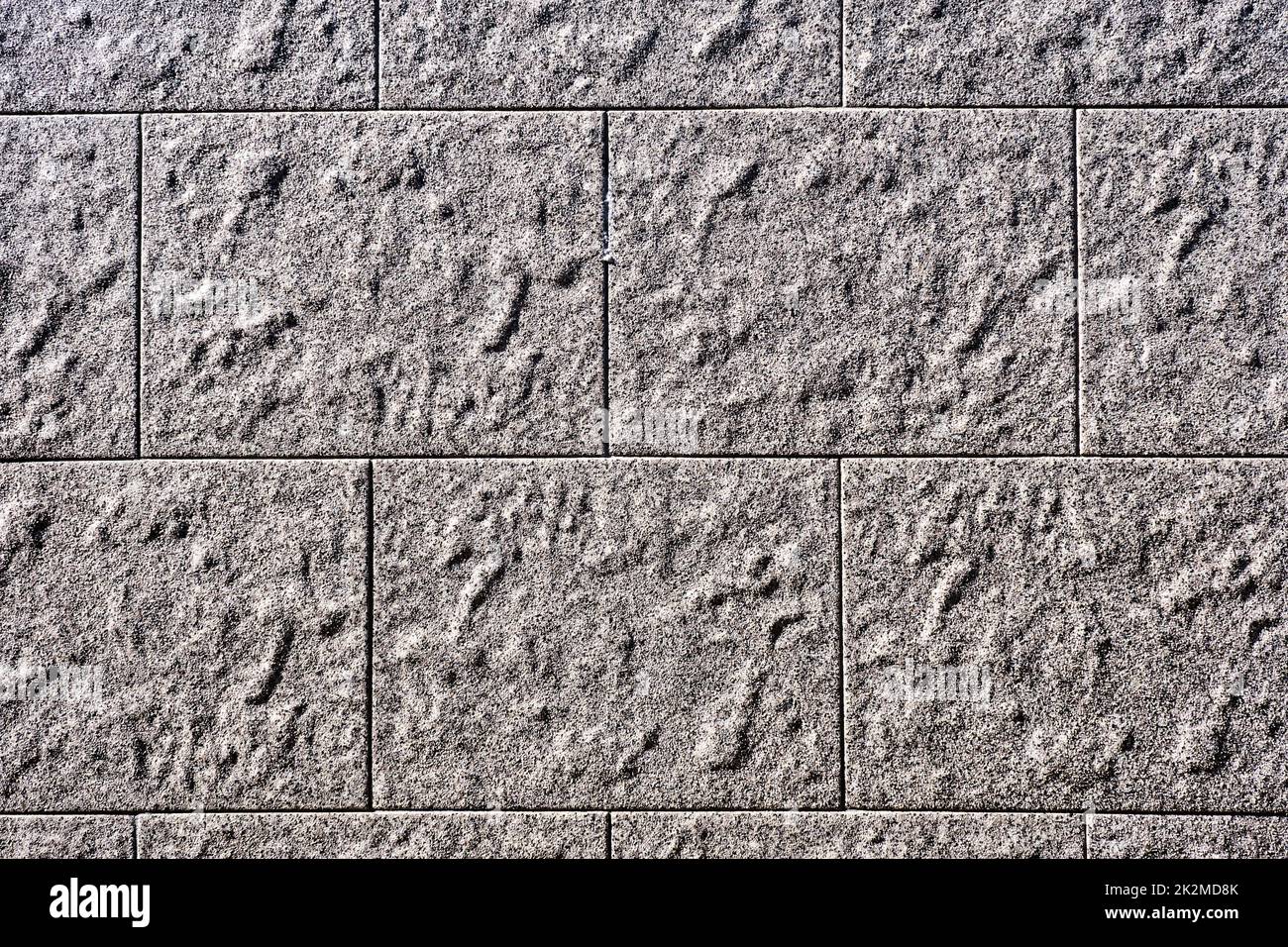 Background from a wall with rectangular grey stone slabs Stock Photo