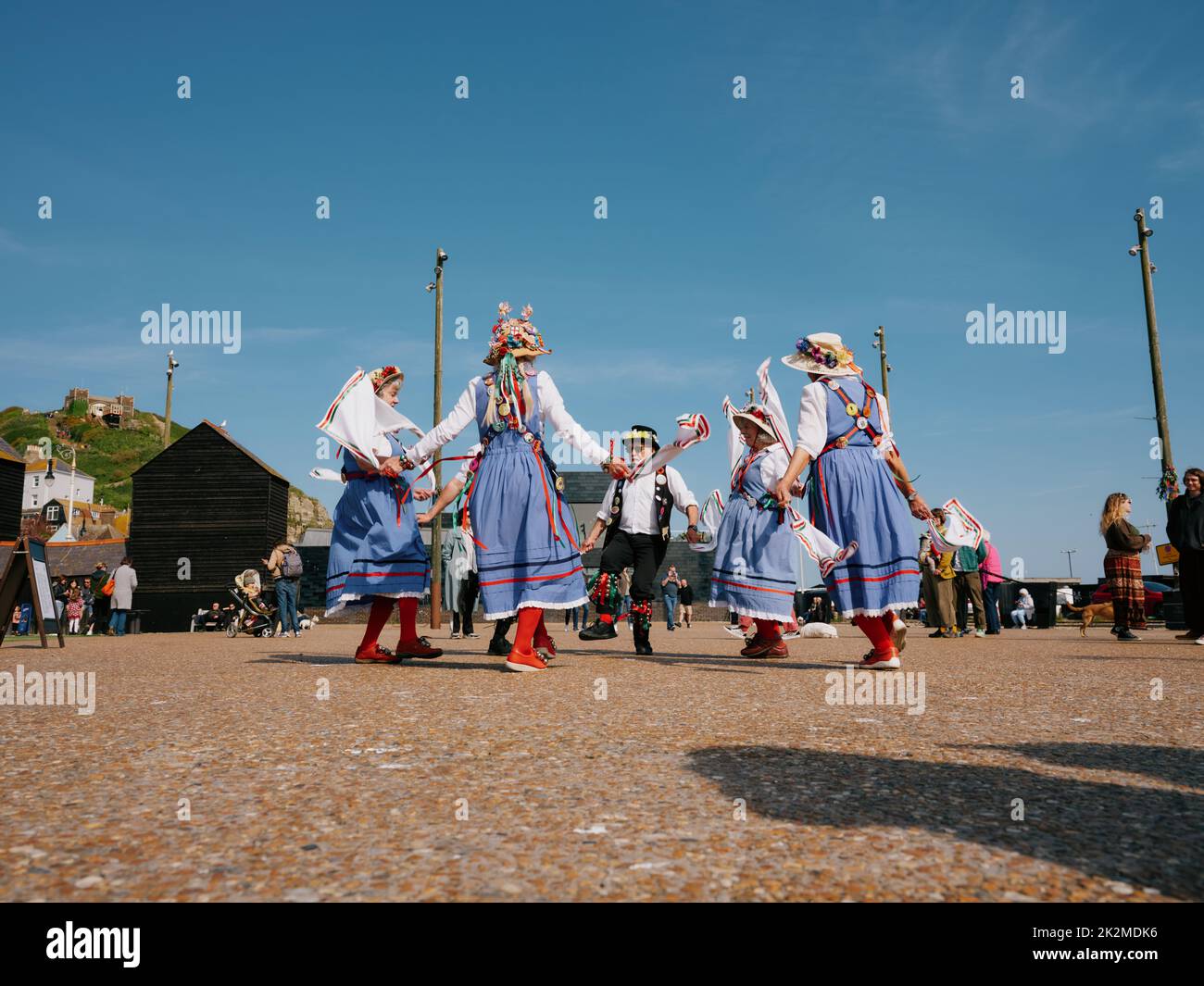 Morris dancers dancing in The Stade open space at the Jack in the Green festival May 2022 - Hastings East Sussex England UK Stock Photo