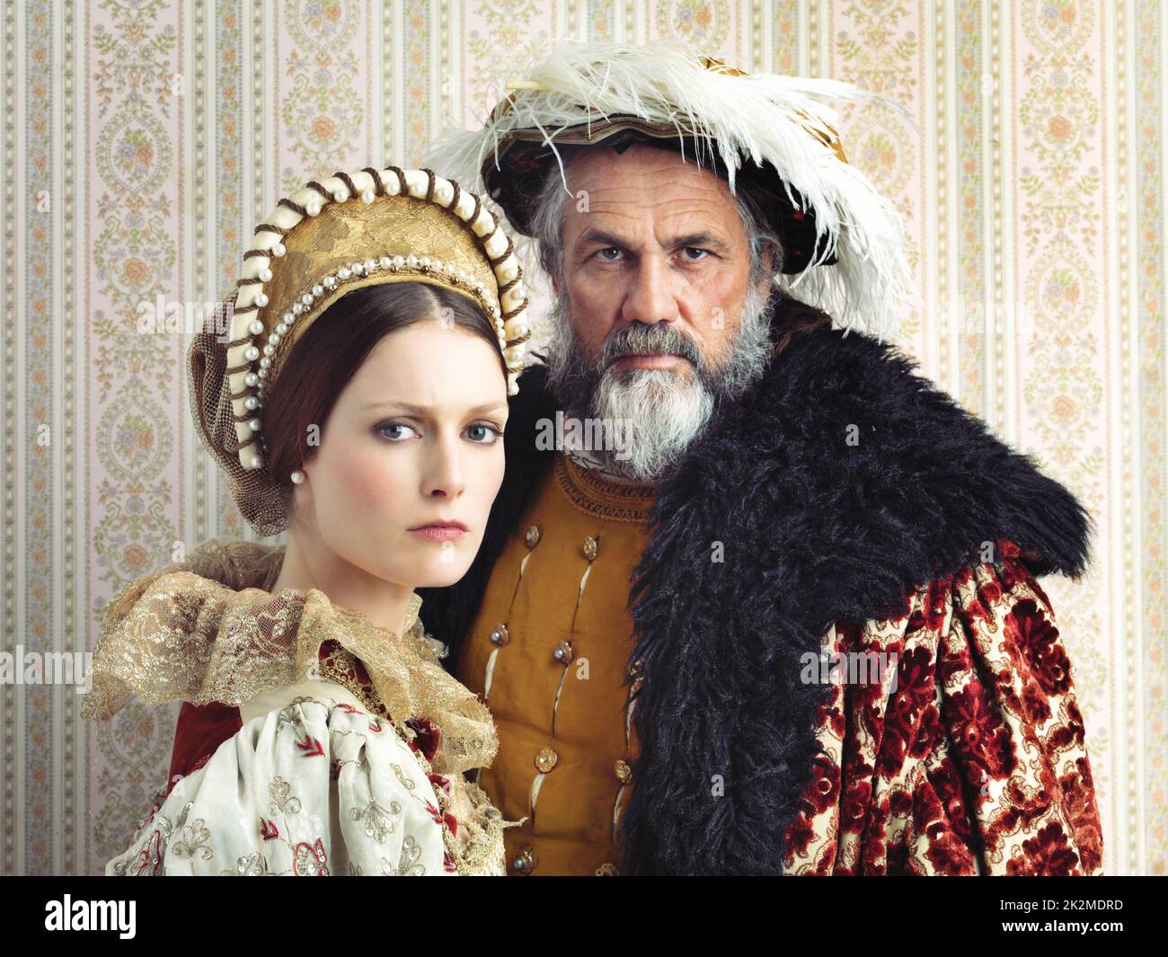 Just but stern rulers. Portrait of a stern-looking king and queen. Stock Photo