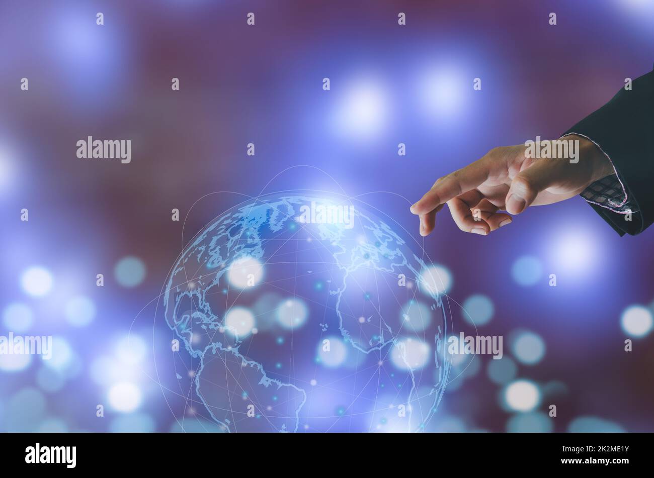 Businessman hand touching global network connecting the modern technology using the investment in the Internet network. Stock Photo