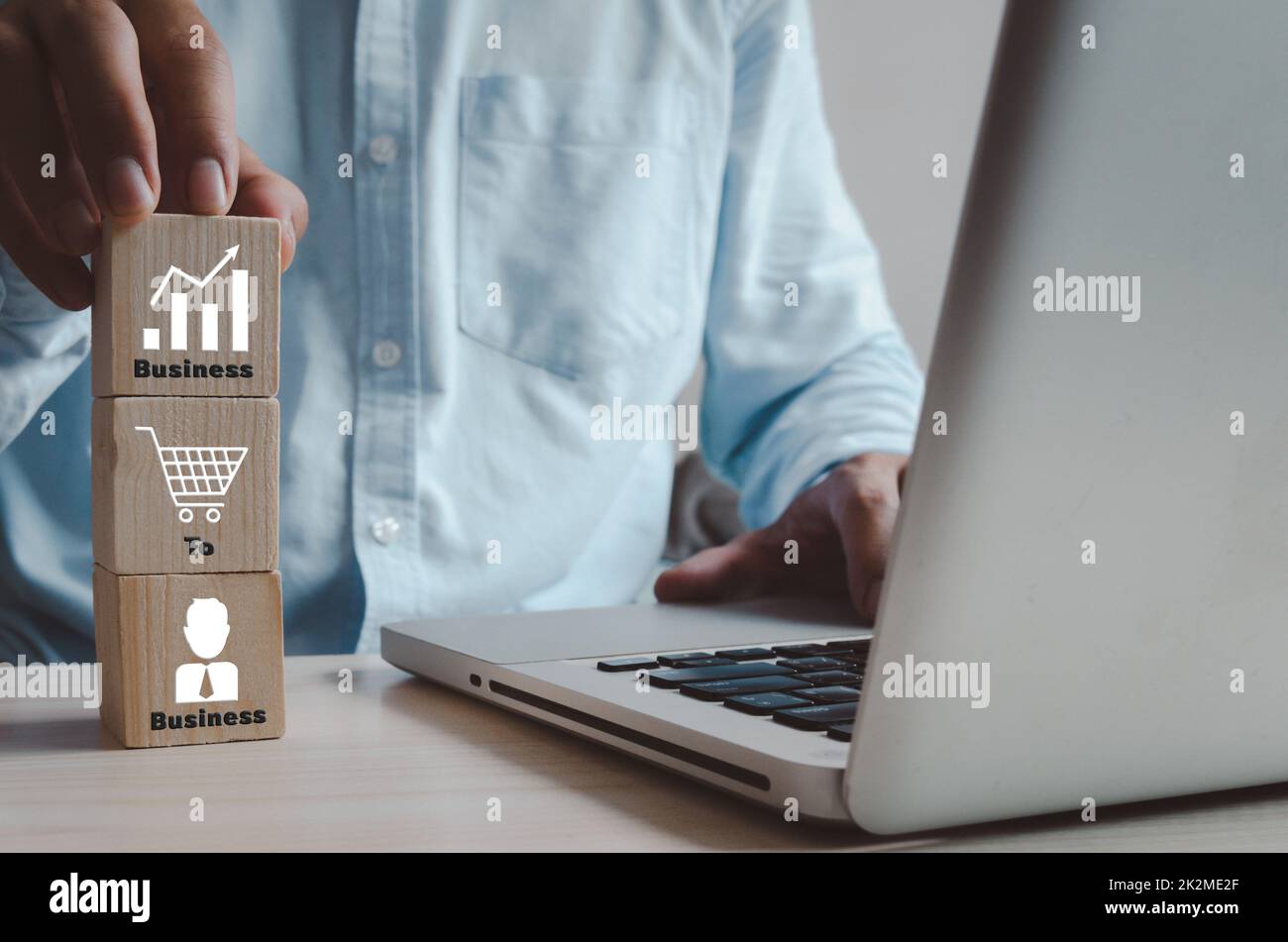 wooden cubes with B2B Business to Business and icons on table and copy space.Business concepts. Stock Photo