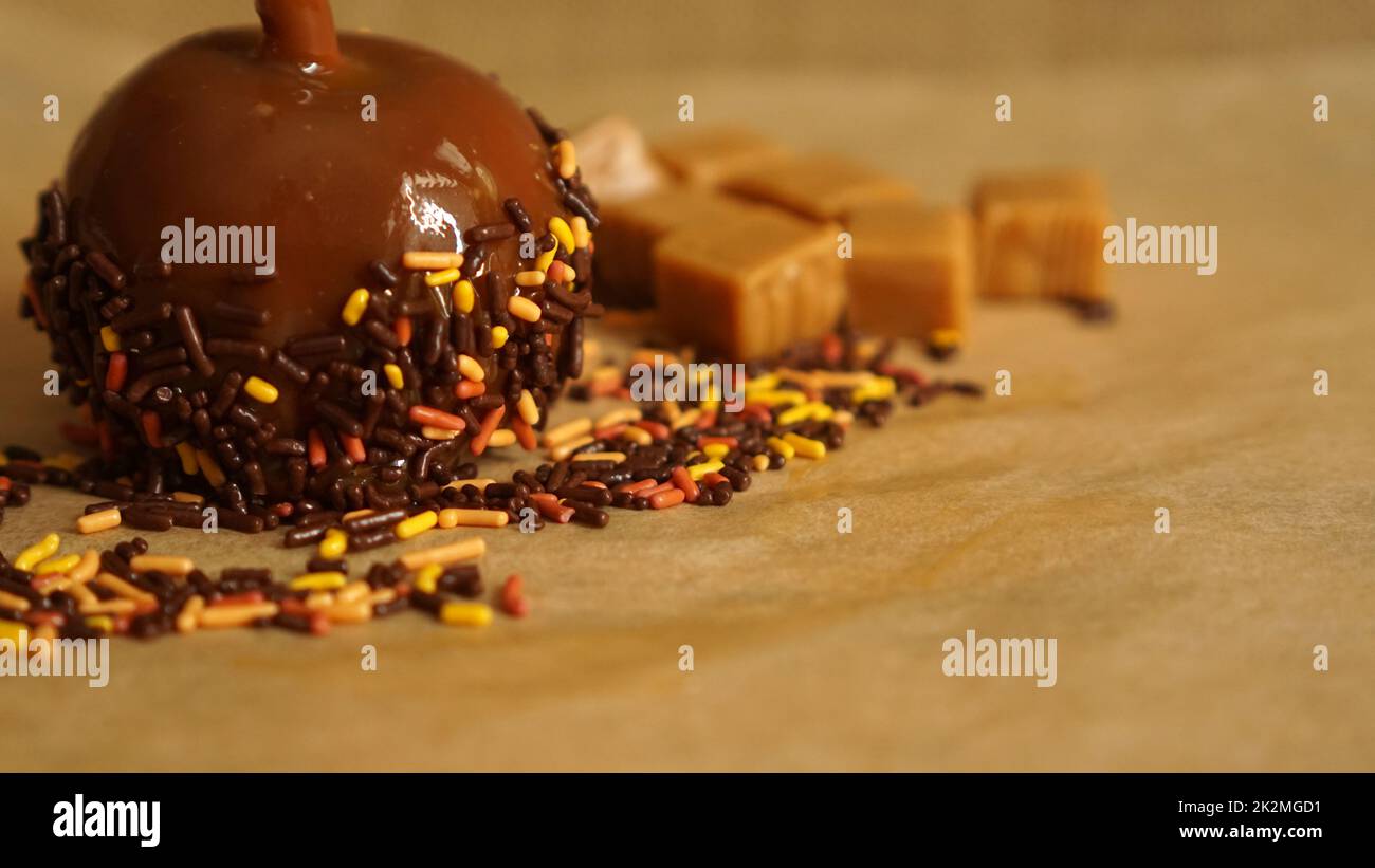 Caramel apple for autumn or Halloween with copy space Stock Photo