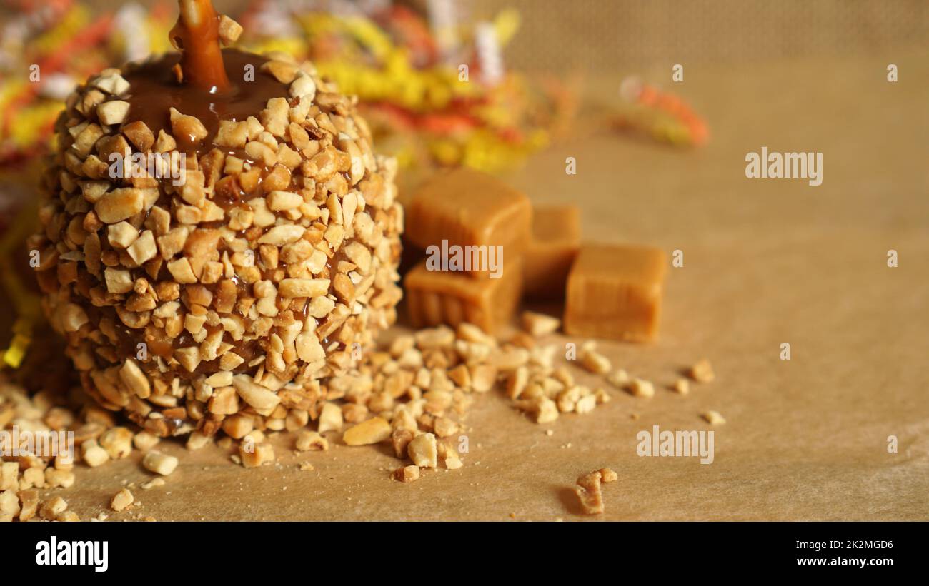 Caramel apple for autumn or Halloween with copy space Stock Photo