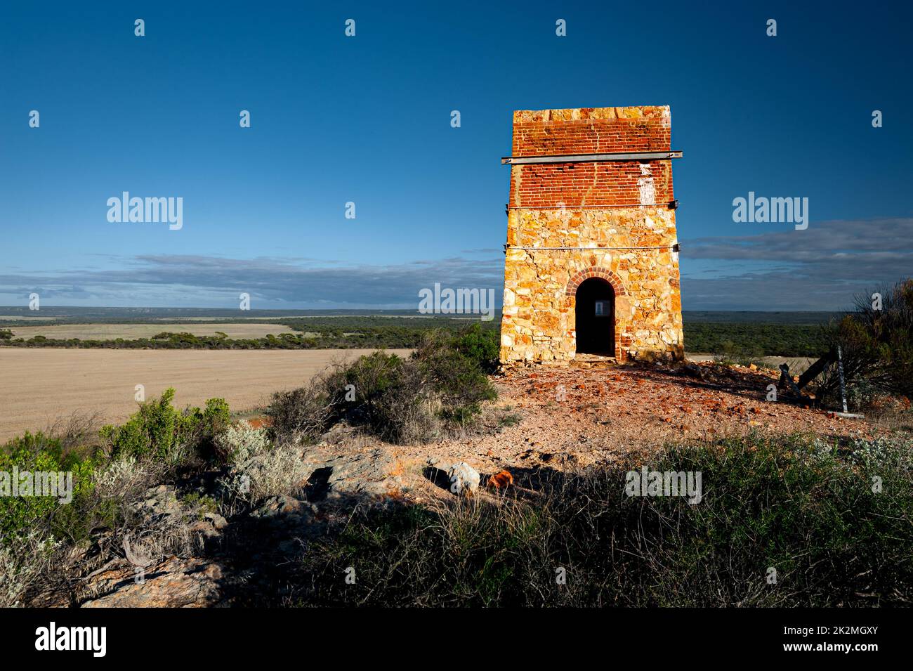 Historical Warribano Chimney towering on a hill in Western Australia's Outback. Stock Photo