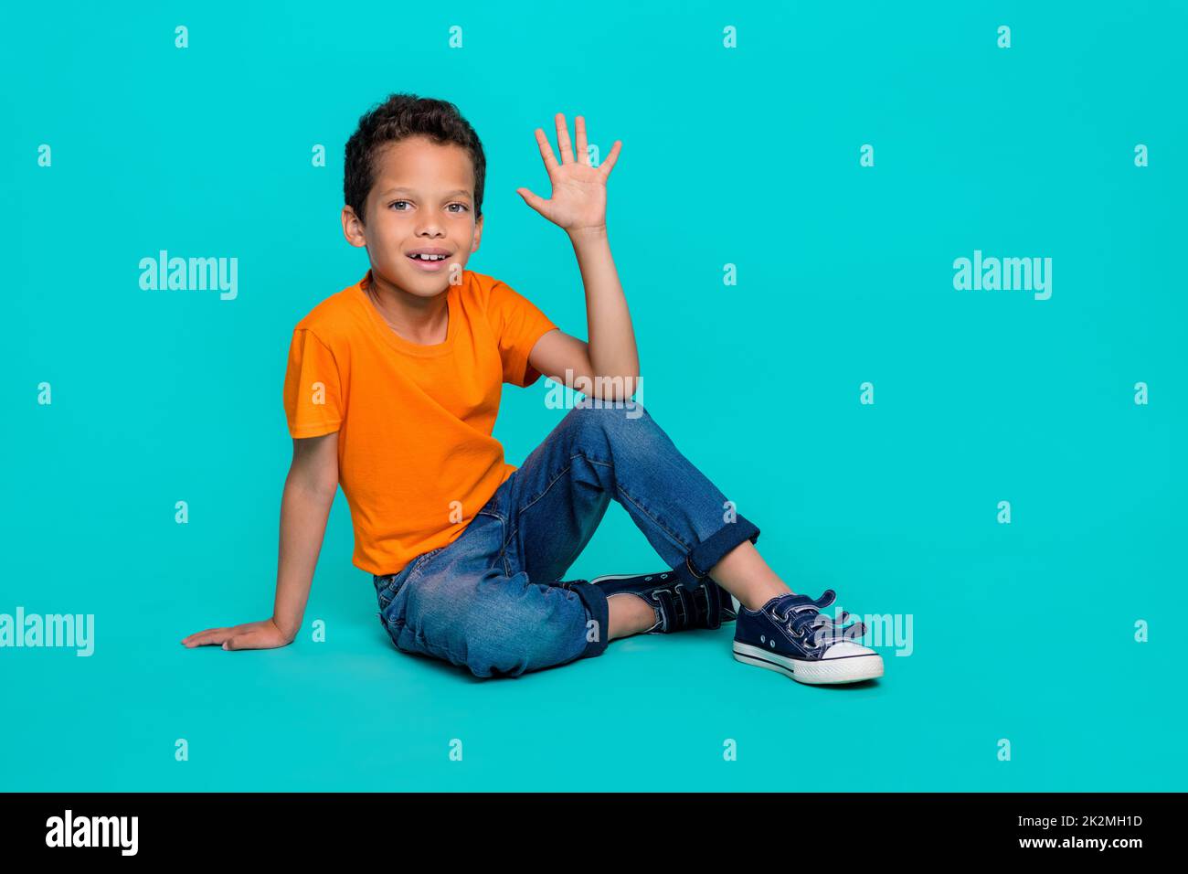 Photo of attractive positive boy show hand arm good mark hi give