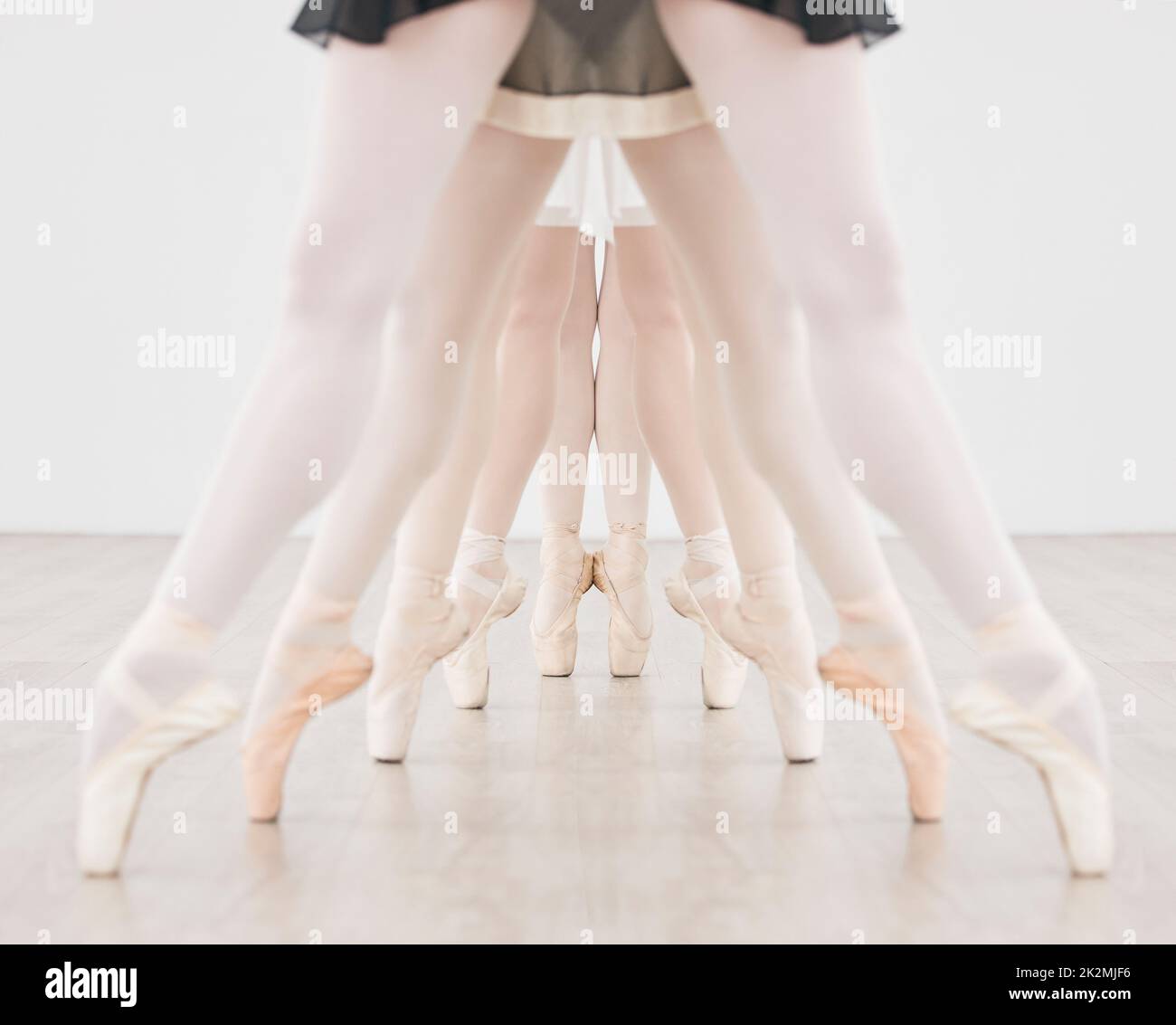 Ballet training, group dance and pointe feet, strong legs and dancing skill in performance class studio. Ballerina dancers, balance and practice line Stock Photo