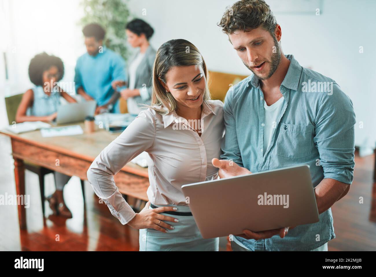 Get a second opinion if you want your work to be perfect. Shot of young designers working in a modern office. Stock Photo