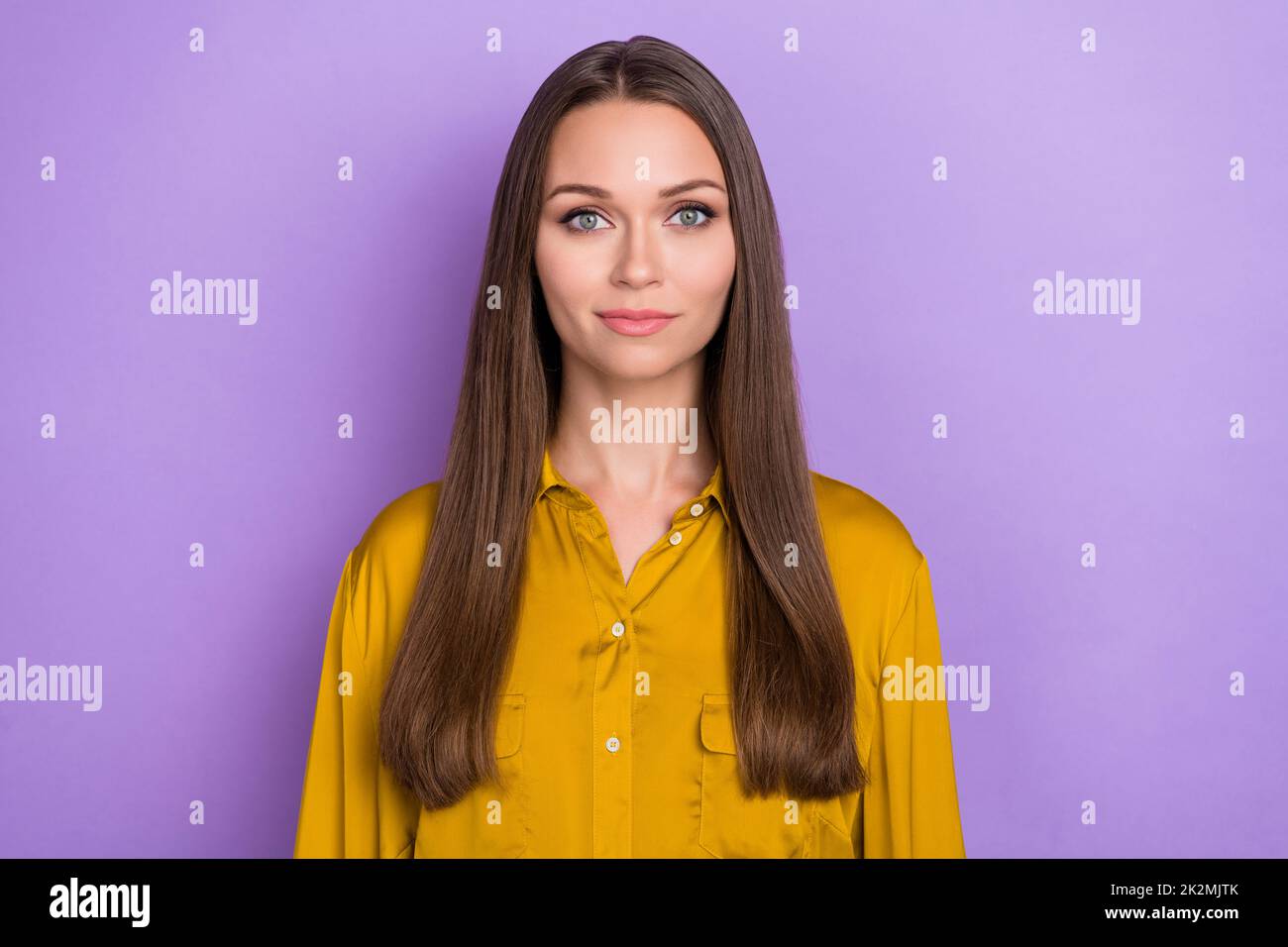 Photo of gorgeous positive nice young girl calm face look camera isolated on violet color background Stock Photo